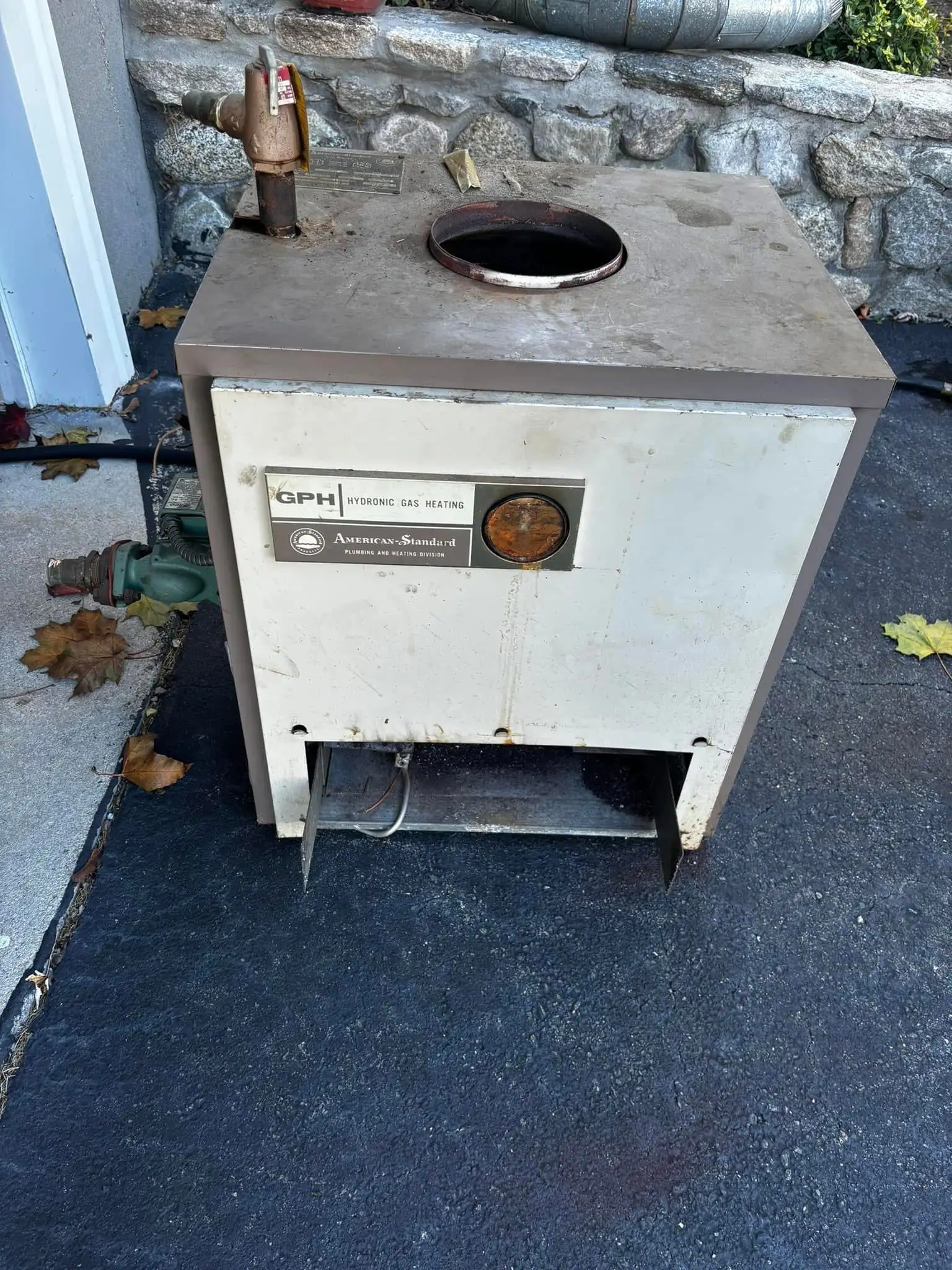 An old boiler on the driveway, headed out after a Hannon replacement
