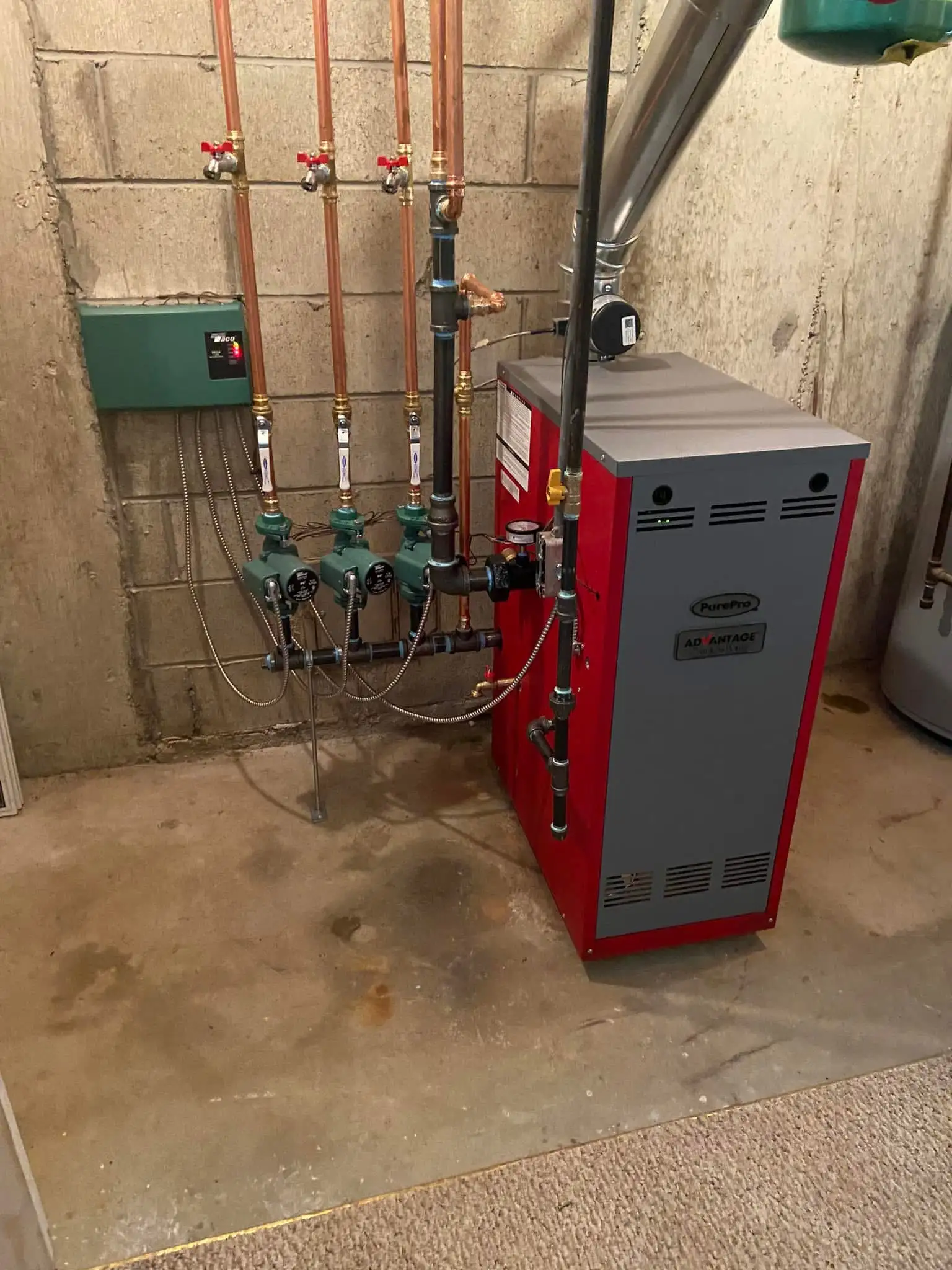New PurePro gas boiler with zone controls and circulator pumps installed by Hannon