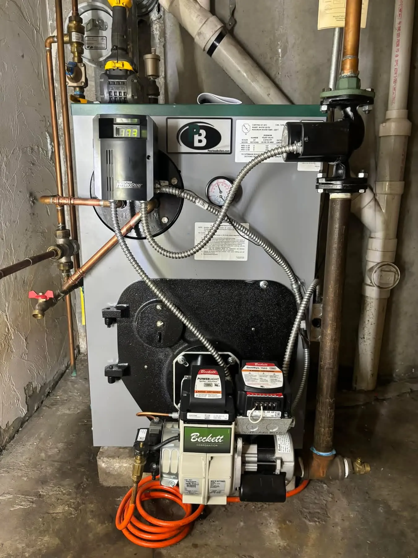 Beckett PowerLight burner with GeniSys control on a Peerless oil boiler serviced by Hannon