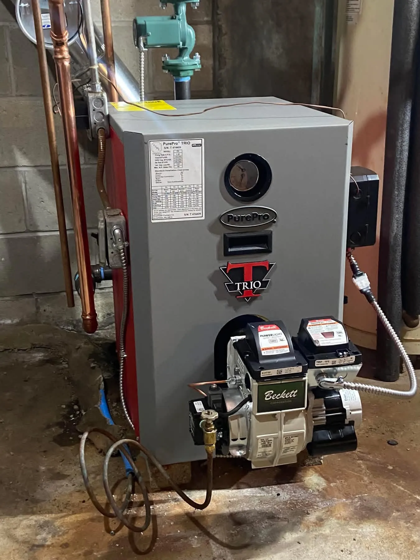 Close-up of a Beckett PowerLight oil burner on a PurePro Trio boiler serviced by Hannon