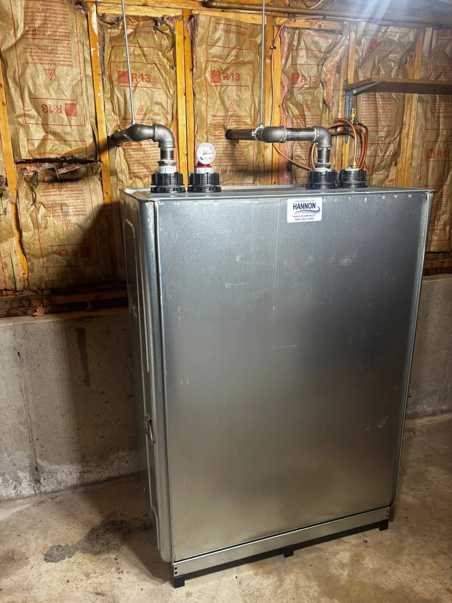 New double-wall oil tank installed by Hannon, with our service sticker on the front