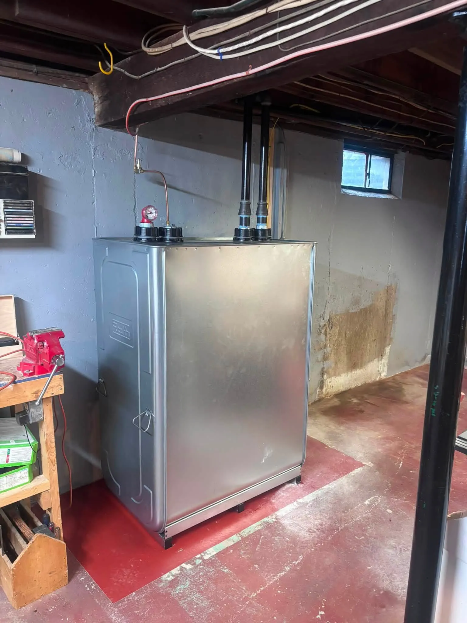 A new Roth double-wall oil tank installed by Hannon in a tidy basement